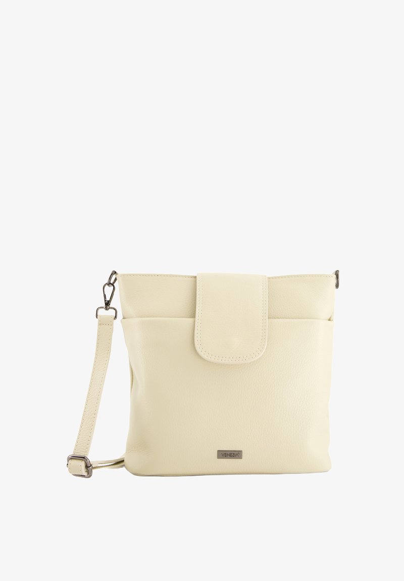 Cream-colored leather crossbody bag with a flap closure, adjustable strap, front pocket, and metal brand logo detail.