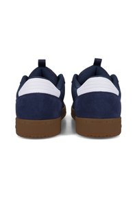 Pair of navy blue and white sneakers with brown soles shown from the back on a white background.