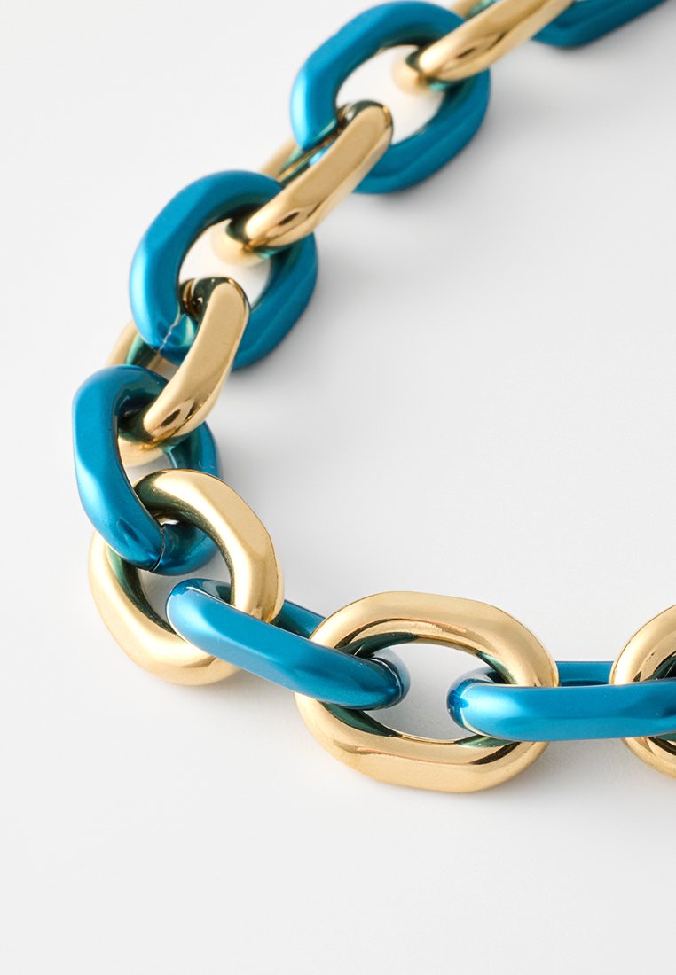 Teal and gold link chain necklace featuring glossy, oval-shaped links with smooth surfaces, alternating between colors and finishes.