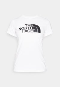 Vit bomulls t-shirt med en svart logotyp av "THE NORTH FACE" och en kurvad grafisk design på framsidan. Klassisk rund hals och korta ärmar.