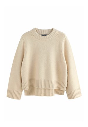 Beige knitted sweater with a ribbed crew neckline and ribbed hem, featuring a relaxed fit and layered design for added texture.