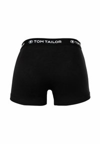 Boxer shorts neri in cotone con un'ampia vita elastica che presenta il testo "TOM TAILOR" in bianco. Texture liscia e design aderente.
