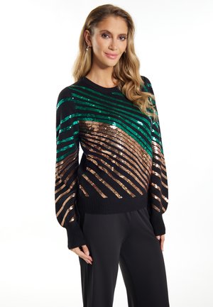 Pulover negru cu dungi diagonale din paiete verzi și cupru. Textură moale din tricot, poale și manșete cu nervuri. Mâneci lungi cu un croi relaxat.