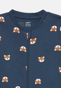 Un body en coton à manches longues avec une base bleu marine et un motif intégral de visages de renards en orange et blanc. Fermeture éclair à l'avant.