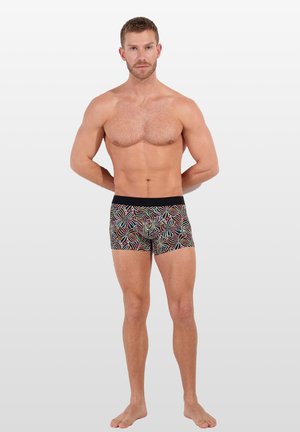 Pantaloni boxer multicolori con un motivo a vortice su sfondo nero. Vita elastica, design aderente e realizzati in tessuto liscio.