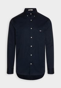 Marineblauwe overhemden met lange mouwen, een klassieke kraag, een borstzak en subtiele logo borduursels. Gemaakt van gladde katoenstof.