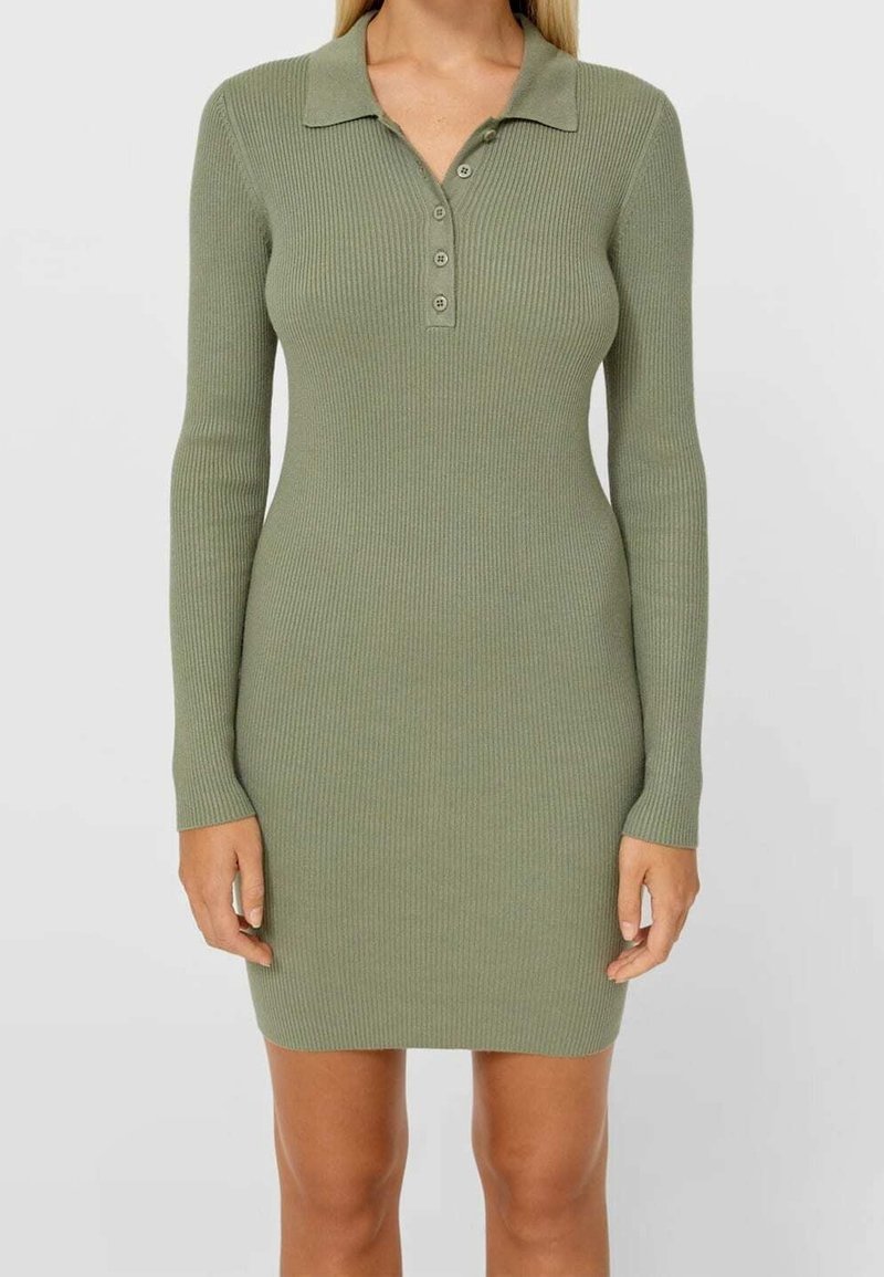 Ribbed, long-sleeve dress in olive green with a polo collar and three button placket. Fitted design accentuates shape.