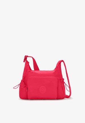 Czerwona nylonowa torba na ramię z zamkiem błyskawicznym z przodu, regulowanym paskiem i detalem logo. Gładka struktura z zaokrąglonymi krawędziami.