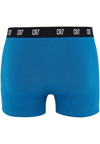 Boxers de algodón azules con una cinturilla elástica negra que presenta la marca "CR7" en blanco. Textura suave y diseño ajustado.