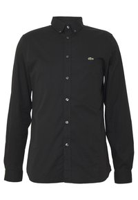 Czarna koszula z długim rękawem, wykonana z bawełny, z kołnierzykiem zapinanym na guziki, przednimi guzikami oraz małym zielonym logo na lewej piersi.