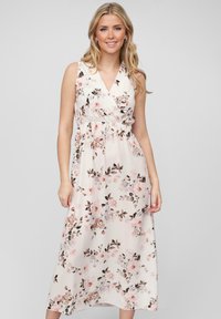 Floral maxi jurk met een witte achtergrond en roze en bruine bloemenpatronen, v-hals en een elastische taille voor comfort.