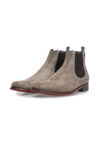 Wildlederstiefeletten in Hellgrau mit schwarzen elastischen Seitenpaneelen, runder Zehenform und rotem Akzent auf der Sohle; schlankes Design mit glatter Textur.