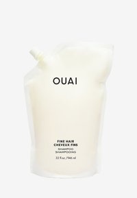 OUAI Fijn Haar Shampoo in een flexibele witte zak met een schroefdeksel, gelabeld met zwarte tekst. Bevat 32 fl oz (946 ml) product.