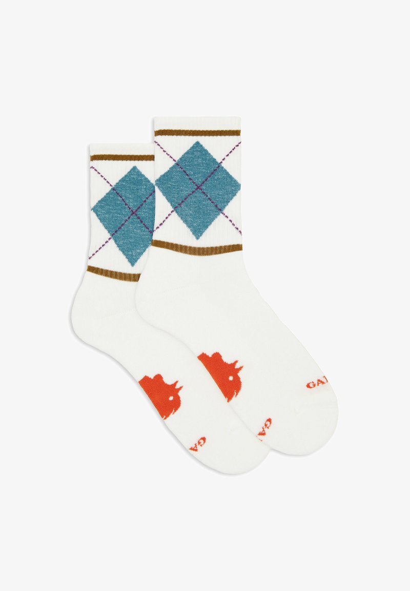 Coppia di calzini bianchi con motivo argyle blu, strisce marroni vicino alla parte superiore e un grafico di rinoceronte arancione nell'area del piede.