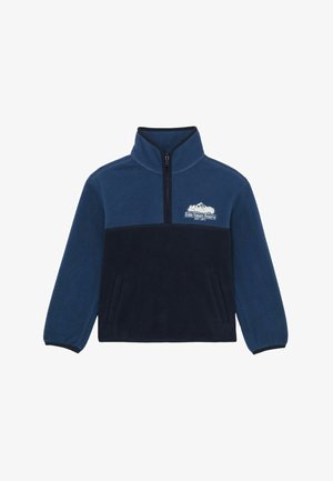 Predĺžená mikina z tmavomodrého flísu s polovičným zipsom, s tmavším námorníckym panelom vpredu, bočnými vreckami a bielym detailom loga hory.