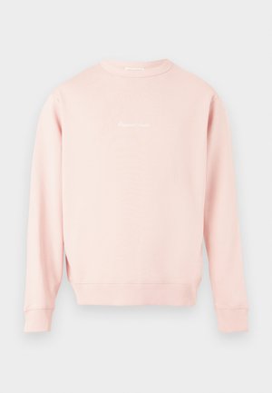 Lys pink sweatshirt med rund hals og lange ærmer, med lille hvid kursiv tekst centreret på brystet, ribstrikkede manchetter og linning.