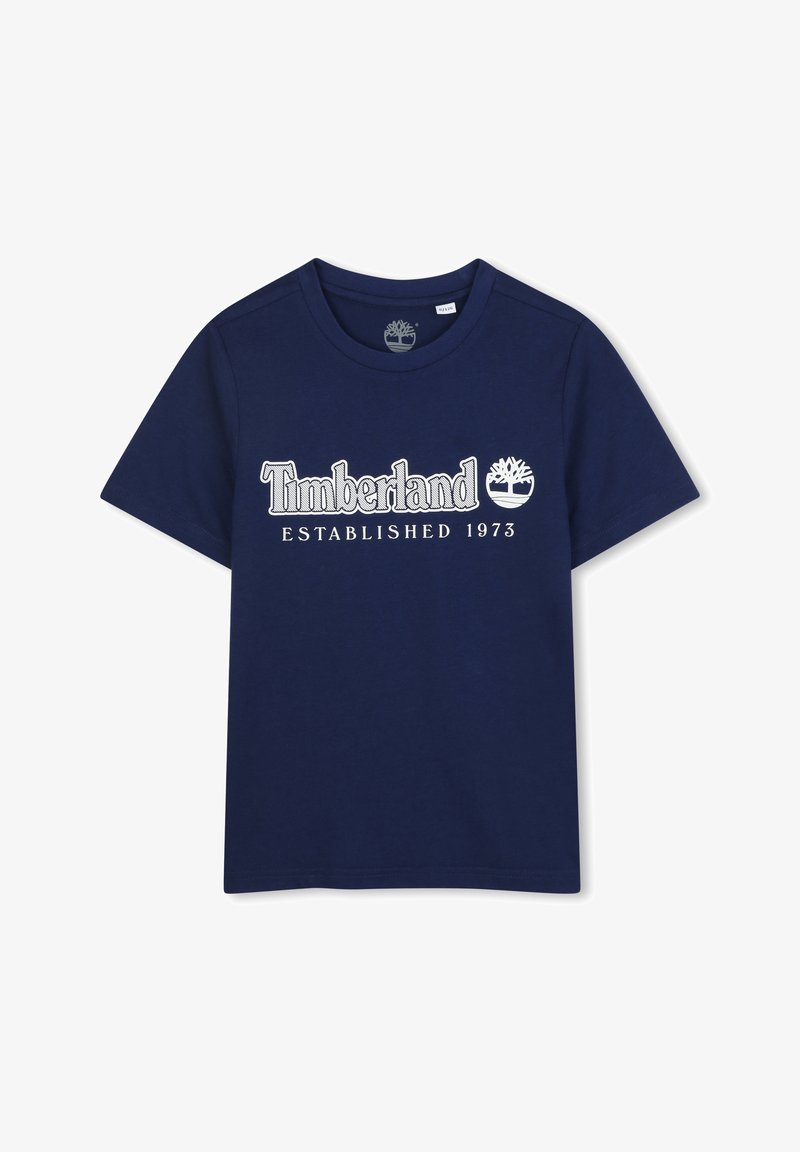 T-shirt en coton bleu marine avec le logo "Timberland" en blanc, date de création 1973 et graphique d'arbre. Col rond et manches courtes.