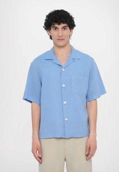 Light blue short-sleeve shirt made of lightweight fabric, featuring a button-up front, a chest pocket, and a relaxed fit design.