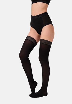 Schwarze Oberschenkelstrümpfe mit einem strukturierten Bund, die eine glatte Oberfläche haben und durch einen elastischen Halt sicheren Tragekomfort bieten.