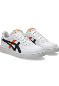 White leather sneakers with black and orange accents. Round toe, lace-up design, and textured rubber sole. ASICS logo on heel and tongue.