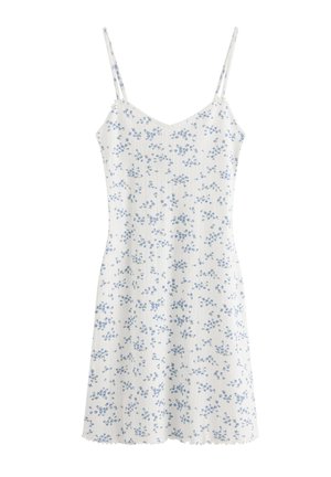 Hvid ærmeløs kjole med tynde stropper og lille blåt blomsterprint over det hele, med bølget kant og tætsiddende overdel.