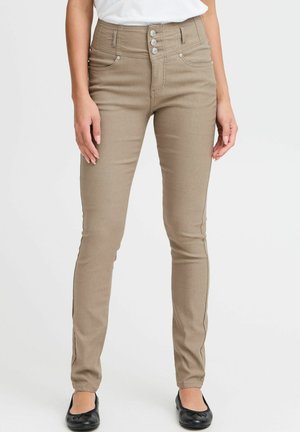 Jean taille haute beige avec fermeture à cinq boutons, poches avant et coupe slim. Tissu lisse avec un léger brillant, jambes fuselées.