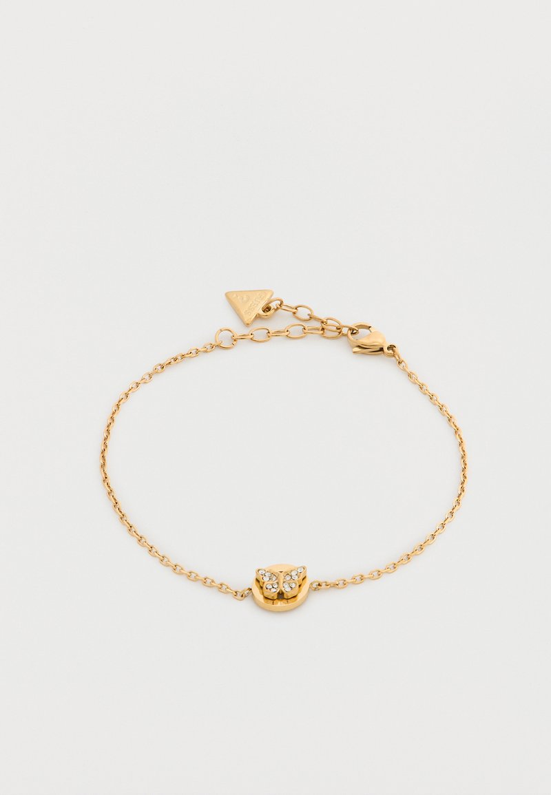 Λεπτό βραχιόλι από χρυσή αλυσίδα με μοτίφ πεταλούδας διακοσμημένο με μικρά λευκά κρύσταλλα και ρυθμιζόμενο κούμπωμα με τριγωνική ετικέτα.