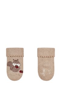 Beige Socken mit einem Eichhörnchen-Motiv, das eine Eichel hält, mit geripptem Bund und strukturiertem Obermaterial; einfarbig auf der Rückseite.