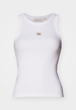White ribbed tank top, featuring a fitted design, round neckline, and small beige logo label with red accents on the front. Made of cotton blend.