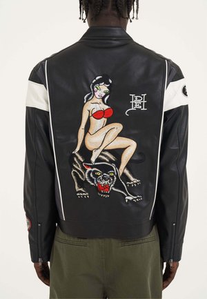 Black leather jacket featuring embroidered pin-up art and a panther. Includes white accent stripes and a zipper on the sleeves.