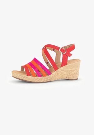 Wedge sandals featuring red suede straps with orange and pink accents, a textured light wood outsole, and an adjustable ankle strap.