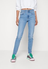 Levi's® 721™ HIGH RISE SKINNY - Uske traperice - light indigo worn in