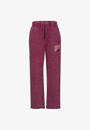 Maroonfarbene Jogginghose mit elastischem Bund und Kordelzug, mit dem Text "19768" und kleinem Logo am oberen linken Oberschenkel.