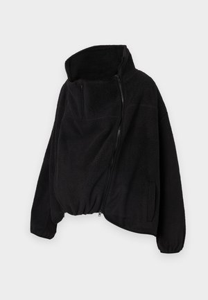 Black fleece jacket with a high collar, zippered front, and elastic hem. Features a chest pocket and side pockets. Soft, textured fabric.