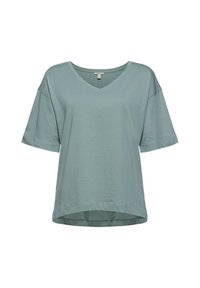 T-shirt à manches courtes et col en V coupe ample de couleur verte douce avec épaules légèrement tombantes et ourlet arrondi.