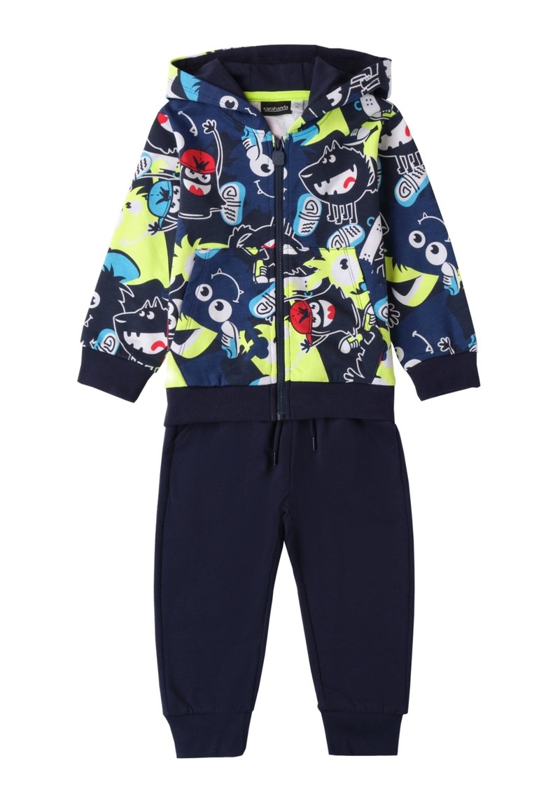 Set bestehend aus Kapuzenpullover und Hose in Marineblau. Der Kapuzenpullover hat bunte Cartoonfiguren auf schwarzem Hintergrund; die Hose ist in einem einfarbigen Marineblau mit elastischen Bündchen.