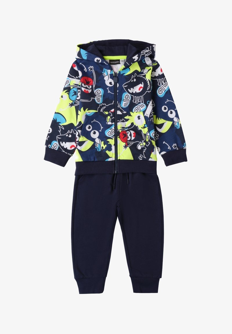 Set bestehend aus Kapuzenpullover und Hose in Marineblau. Der Kapuzenpullover hat bunte Cartoonfiguren auf schwarzem Hintergrund; die Hose ist in einem einfarbigen Marineblau mit elastischen Bündchen.