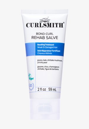 Bande de protection Curlsmith Bond Curl Rehab Salve dans un tube blanc de 60 ml. Présente un texte bleu et noir, énumère les ingrédients et indique une formulation végétalienne.