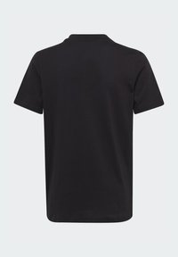 T-shirt in cotone nero con maniche corte, colletto rotondo e texture liscia. Nessun logo o motivo visibile sul retro.