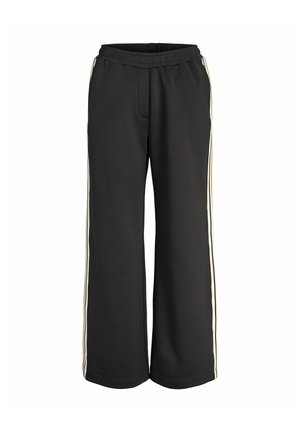 Svarte bukser med vide ben, elastisk midjebånd og hvite side-striper, designet for uformell eller atletisk bruk.