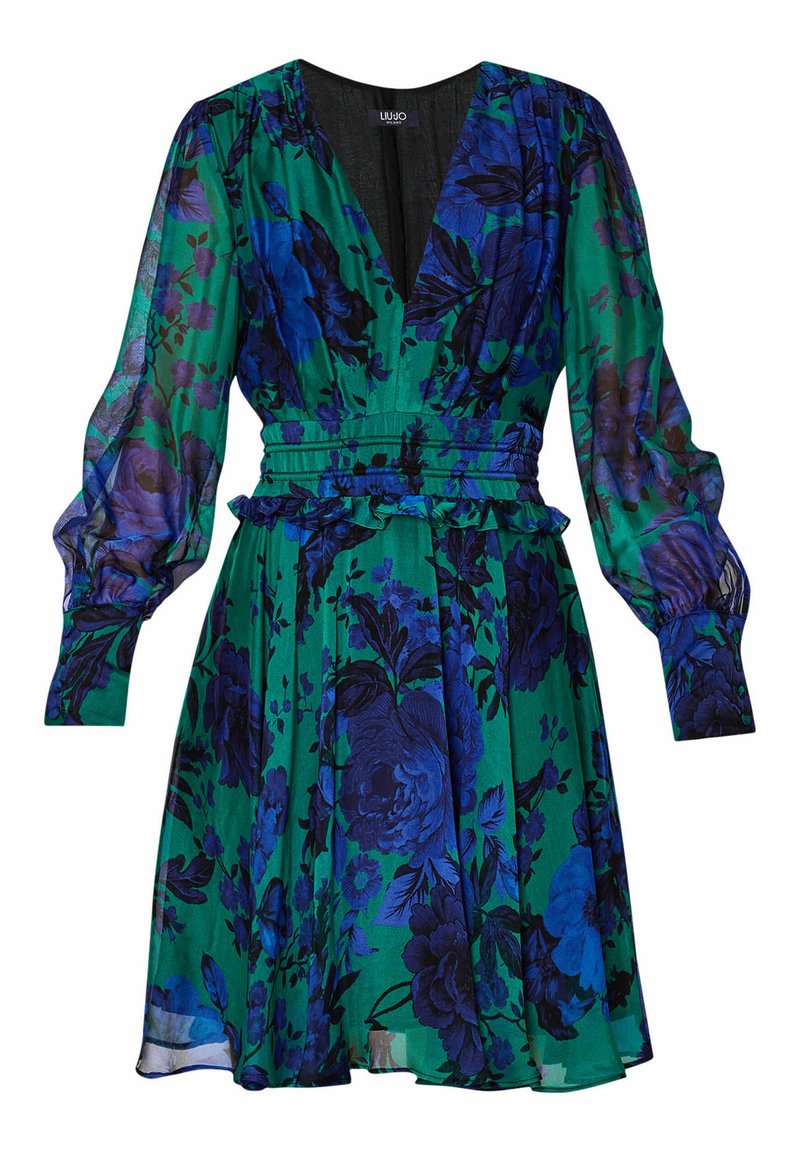 Abito floreale verde con fiori blu e neri, caratterizzato da un profondo scollo a V, lunghe maniche a sbuffo, vita con cintura e orlo arricciato.