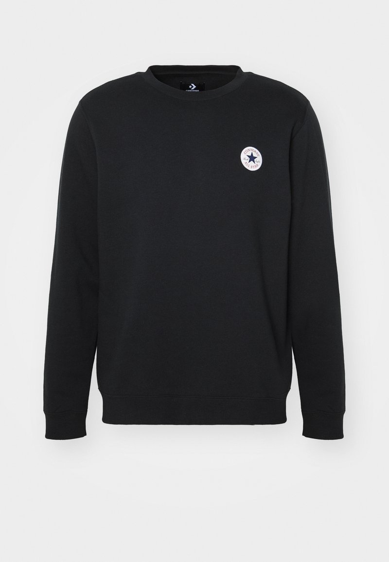 Sudadera negra hecha de una mezcla de algodón, con cuello redondo, mangas largas y un pequeño logo circular en el pecho.