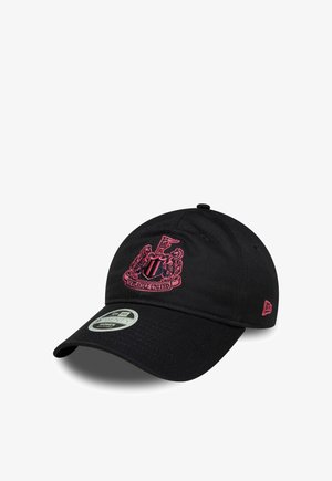 Black baseball cap with red embroidered Newcastle United crest on front and New Era logo on side.
