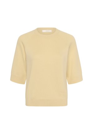 Világos bézs rövid ujjú kötött pulóver bordázott mandzsettákkal, szegéllyel és kerek nyakkivágással, fehér háttéren bemutatva.