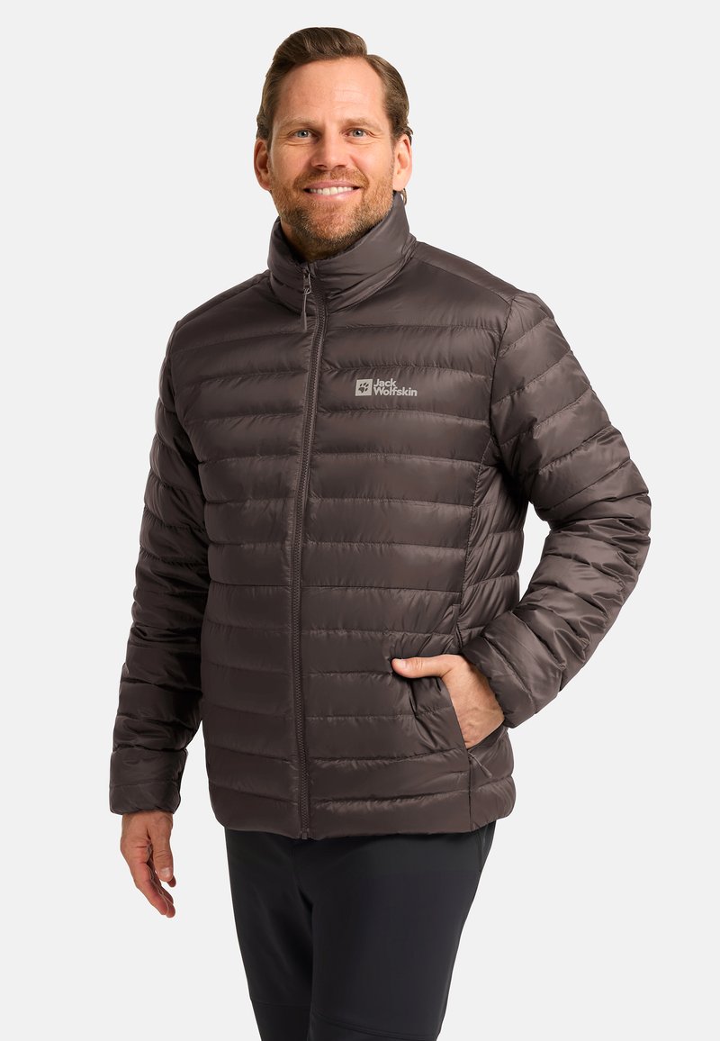 Puffer jacket in dark brown, quilted design with high collar, front zipper, side pockets, and logo on the left chest.