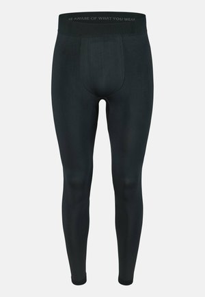 Leggings de sport noirs en matériau extensible, avec une coupe ajustée, une large taille et de subtils accents texturés sur le bas des jambes.