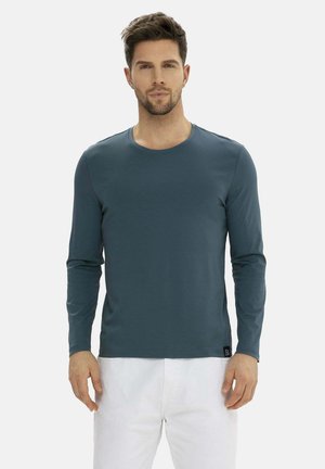 Langärmliges Rundhals-Shirt in Dunkeltürkis, aus weichem Stoff gefertigt. Mit einer geraden Passform und einem kleinen Logotag am unteren Saum.