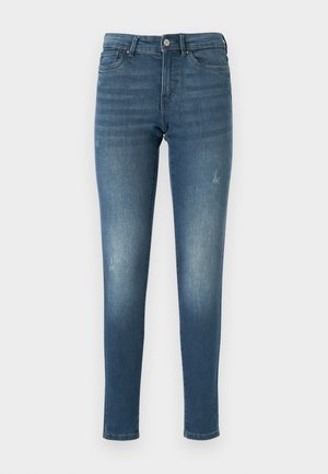 Blaue Denim-Jeans mit schlankem Schnitt, die ausgewaschene Stellen, fünf Taschen und einen Knopfverschluss aufweisen. Der Stoff hat eine glatte, leicht abgenutzte Textur.