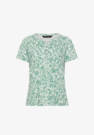 Wit blouse met korte mouwen, groene abstracte bladpatroon en een borstsluiting met vier knopen bij de halslijn.