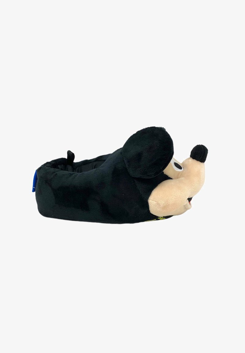 Pantofole di peluche a forma di Topolino con tessuto nero soffice, viso beige, grandi orecchie e superficie testurizzata. Presentano un'etichetta blu sul lato.